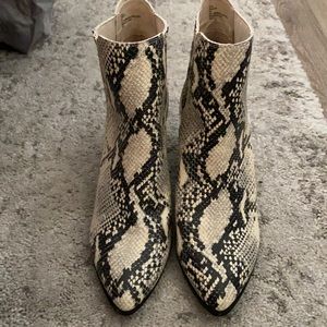 New, never worn but when trying on Steve Madden snake skin booties.